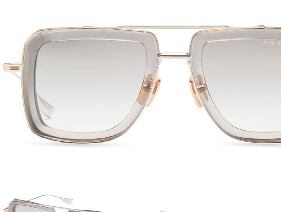 Titanium zonnebril met grijs kristal en gouden accenten